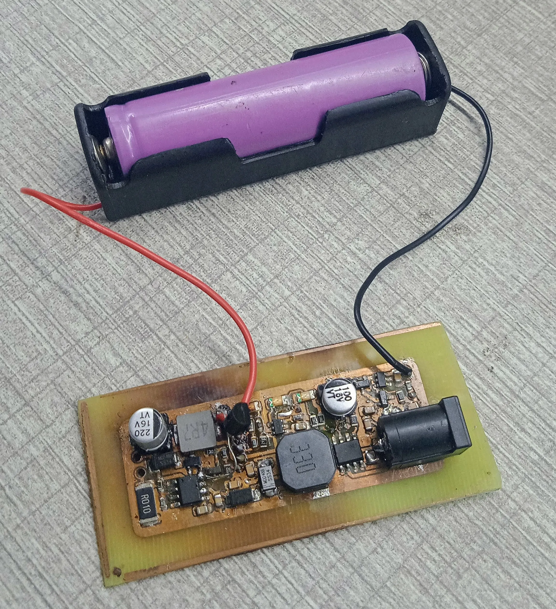 A prototype board with a single-cell battery holder
